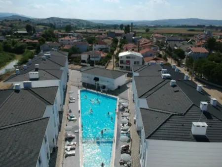 For Sale In A Complex With A Garden And Pool By The Sea In Kumbağ 2 1